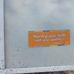 Worship sticker on sign